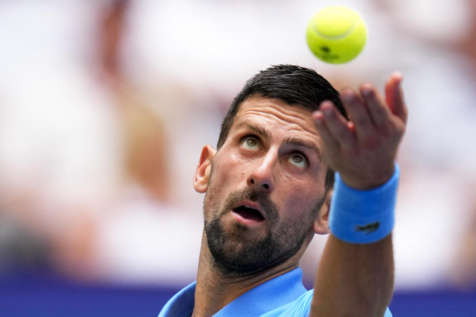 Novak Djokovic, of Serbia, serves to Taylor Fritz, of the United States, during the quarterfinals of the U.S. Open tennis championships, Tuesday, Sept. 5, 2023, in New York. (AP Photo/Manu Fernandez)