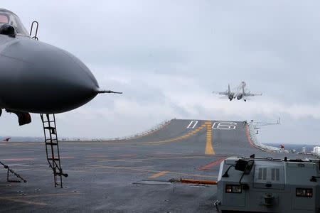 J-15 fighters from China's Liaoning aircraft carrier conduct a drill in an area of South China Sea, January 2, 2017. Picture taken January 2, 2017. REUTERS/Mo Xiaoliang/File Photo