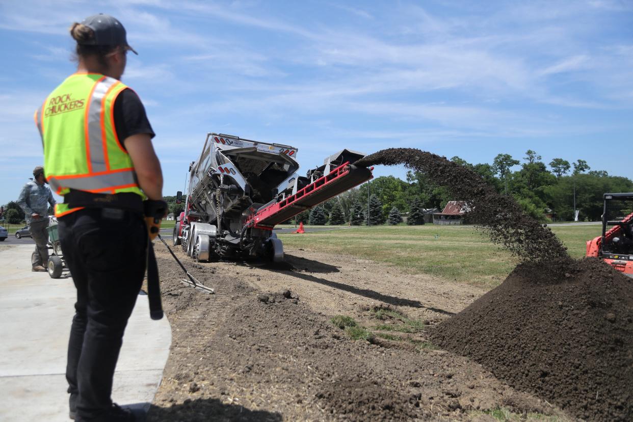 Construction crews landscape the grounds around Jackson Middle School in Grove City on June 17 as part of a South-Western City School District improvement project in collaboration with the Ohio Facilities Construction Commission.