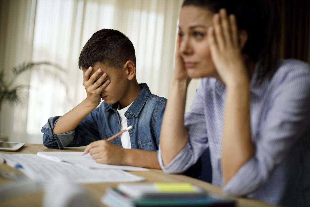 Many parents have had to play the role of a substitute math teacher during the pandemic. <a href="https://www.gettyimages.com/detail/photo/teenage-boy-having-problems-in-finishing-homework-royalty-free-image/1033164818?adppopup=true" rel="nofollow noopener" target="_blank" data-ylk="slk:damircudic/E+ via Getty Images;elm:context_link;itc:0;sec:content-canvas" class="link ">damircudic/E+ via Getty Images</a>