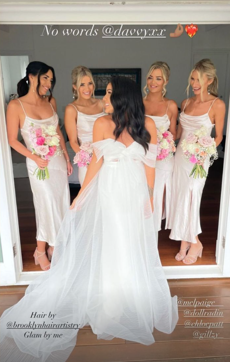 Her bridesmaids were dressed in slinky, midi-length dresses. Photo: Instagram/fernandohervas_mua