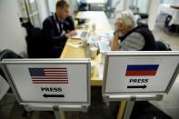 <p>Representatives of Russian media work while U.S. President Donald Trump, Russia’s President Vladimir Putin, and others attend a working lunch meeting at Finland’s Presidential Palace July 16, 2018 in Helsinki, Finland. (Photo: Brendan Smialowski/AFP/Getty Images) </p>