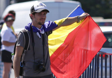 Mihai Podut, a 27-year-old construction worker who left the country in 2014, first for France and later Germany joined an anti-government rally in the capital Bucharest, Romania August 10, 2018. Inquam Photos/Octav Ganea via REUTERS