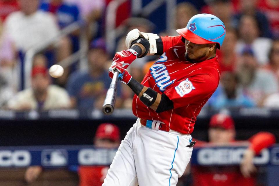 Miami Marlins base runner Luis Arraez (3) hits a single for an RBI during the seventh inning of an MLB game against the Philadelphia Phillies at loanDepot park in the Little Havana neighborhood of Miami, Florida, on Saturday, July 8, 2023.