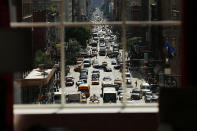 NEW YORK, NY - SEPTEMBER 19: Eighth Avenue is viewed from the 810-square-foot "living room" art installation by Japanese artist Tatzu Nishi which features the iconic 13-foot statue of Christopher Columbus on September 19, 2012 in New York City. Viewed as a piece of conceptual art, "Living Room", which sits 70-feet above ground level and is only accessible via a scaffold-encased staircase, has been temporarily built around the Columbus Monument in Columbus Circle. Beginning Thursday, up to 25 people at a time can enter the living room to view up close the 1892 marble figure of the Italian explorer. (Photo by Spencer Platt/Getty Images)