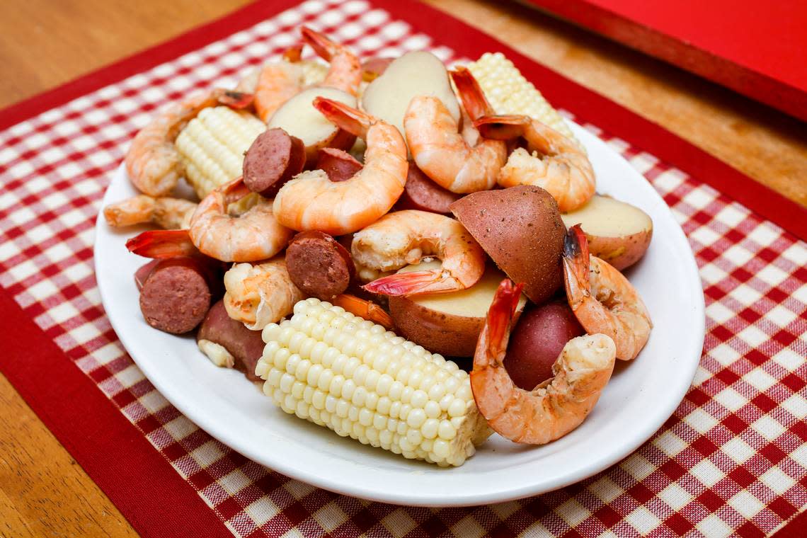 Lowcountry boil, a popular seafood dish, features shrimp, smoked sausage, red potatoes and corn on the cob.