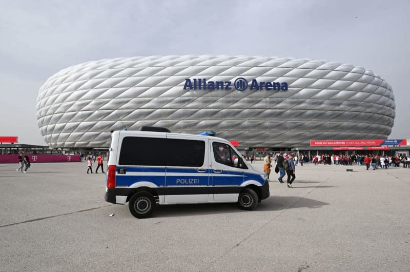 A police vehicle is parked in front of the Allianz Arena ahead of the German Bundesliga soccer match between Bayern Munich and Borussia Dortmund. Sven Hoppe/dpa