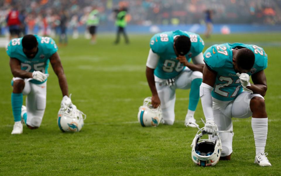 Members of the Miami Dolphins football team have knelt to express their anger against social injustice in the US - Action Images via Reuters