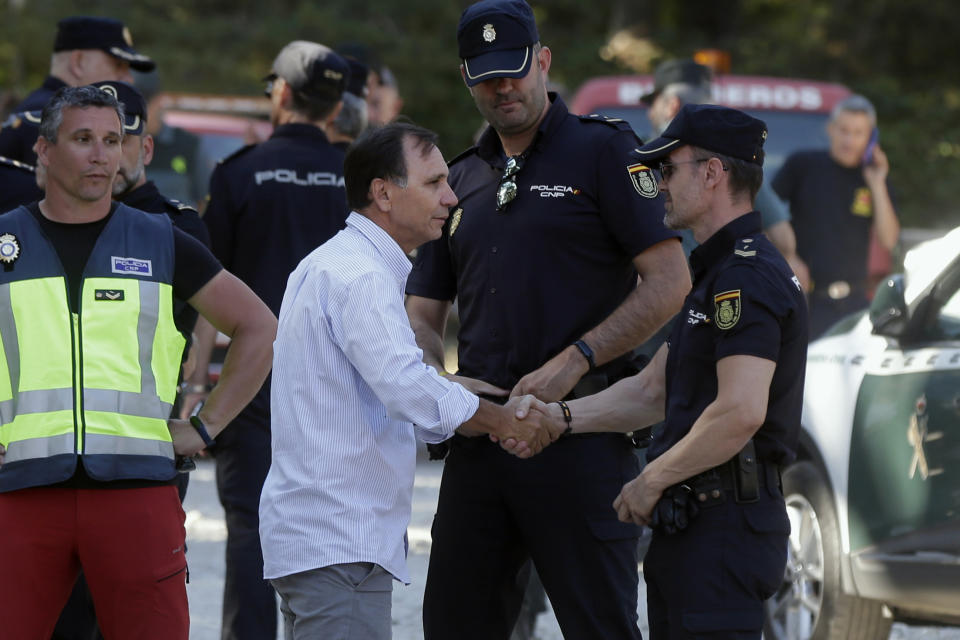 Adrian Federighi, brother in-law of former ski racer Blanca Fernandez Ochoa and spokesperson for the family, thanks police after the search near Cercedilla, just outside of Madrid, Spain, Wednesday Sept. 4, 2019. Spanish police have found the body of former ski racer and Olympic medalist Blanca Fernandez Ochoa in a mountainous area near Madrid. Police said a tracking dog came across a woman's body near a peak in the forested area on Wednesday after days of searching for Spain's first female medalist in the Winter Olympics.(AP Photo/Paul White)