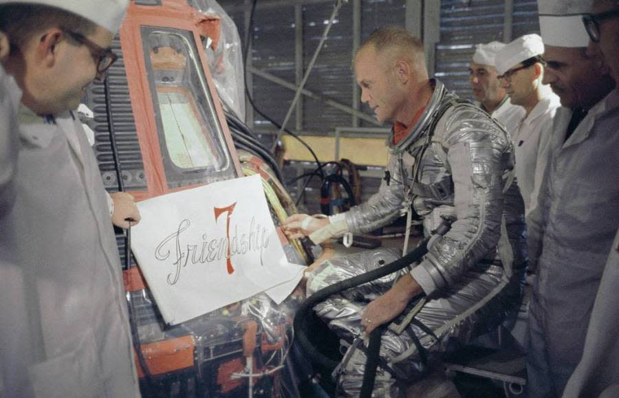 Astronaut John Glenn inspects artwork that will be painted on the outside of his Mercury spacecraft, which he nicknamed Friendship 7. (NASA)