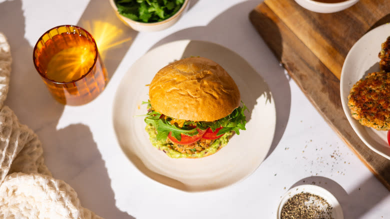 salmon guacamole burger on plate