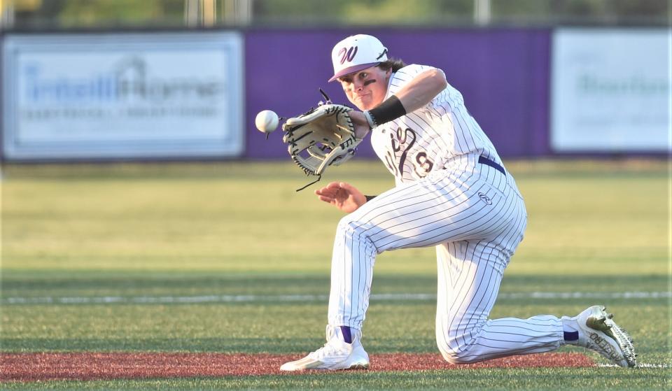 Wylie third baseman Sam Walker fields a grounder by Abilene Cooper's Jaden Smith for the first out in the third inning.