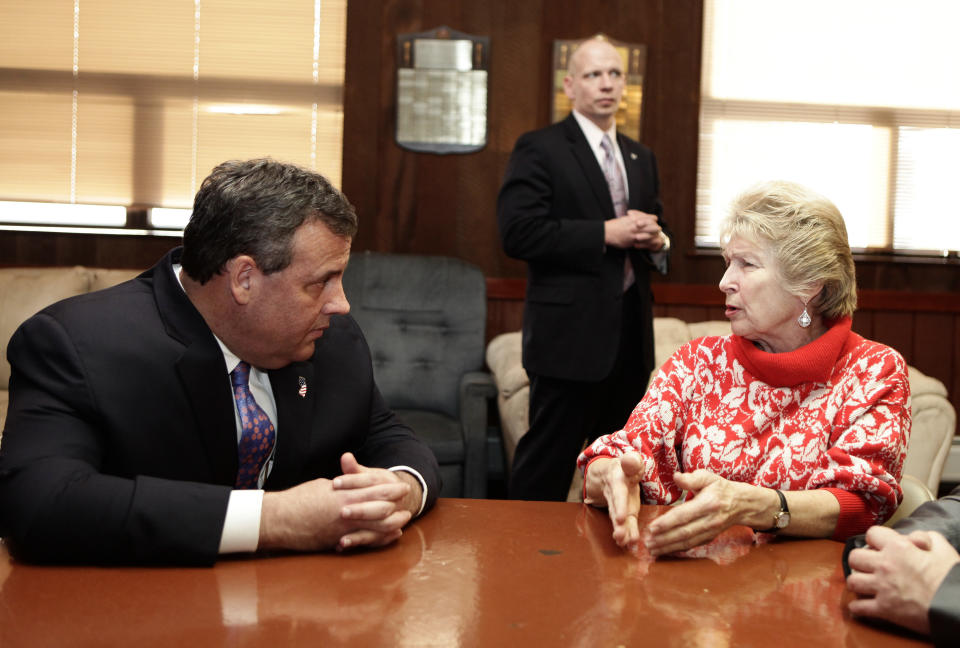 KEANSBURG, NJ - FEBRUARY 04: New Jersey Gov. Chris Christie (L) talks with Irene Neikem (R) a woman affected by Superstorm Sandy at a lounge in the New Point Comfort Fire Company on February 4, 2014 in Keansburg, New Jersey. Christie, whose governorship is being threatened by a scandal is facing federal investigation over use of Sandy funds.  (Photo by Kena Betancur/Getty Images)