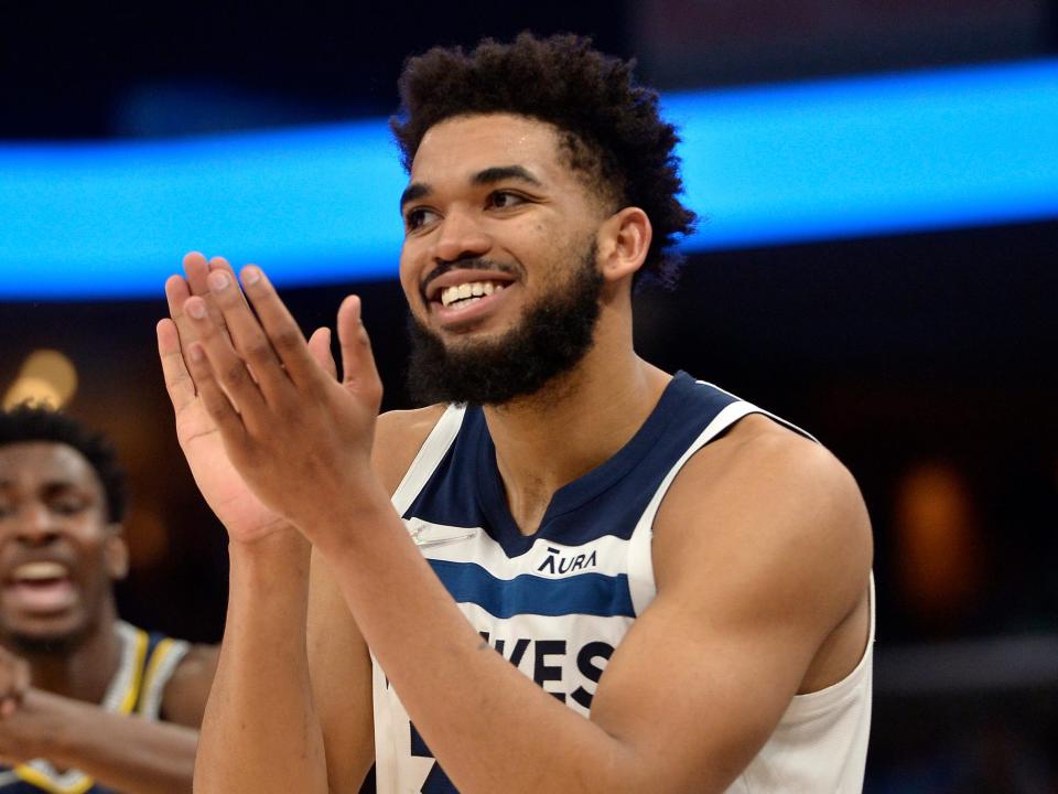 Minnesota Timberwolves center Karl-Anthony Towns (32) and Memphis Grizzlies forward Jaren Jackson Jr. (13) react in the second half during Game 5 of a first-round NBA basketball playoff series Tuesday, April 26, 2022, in Memphis, Tenn.