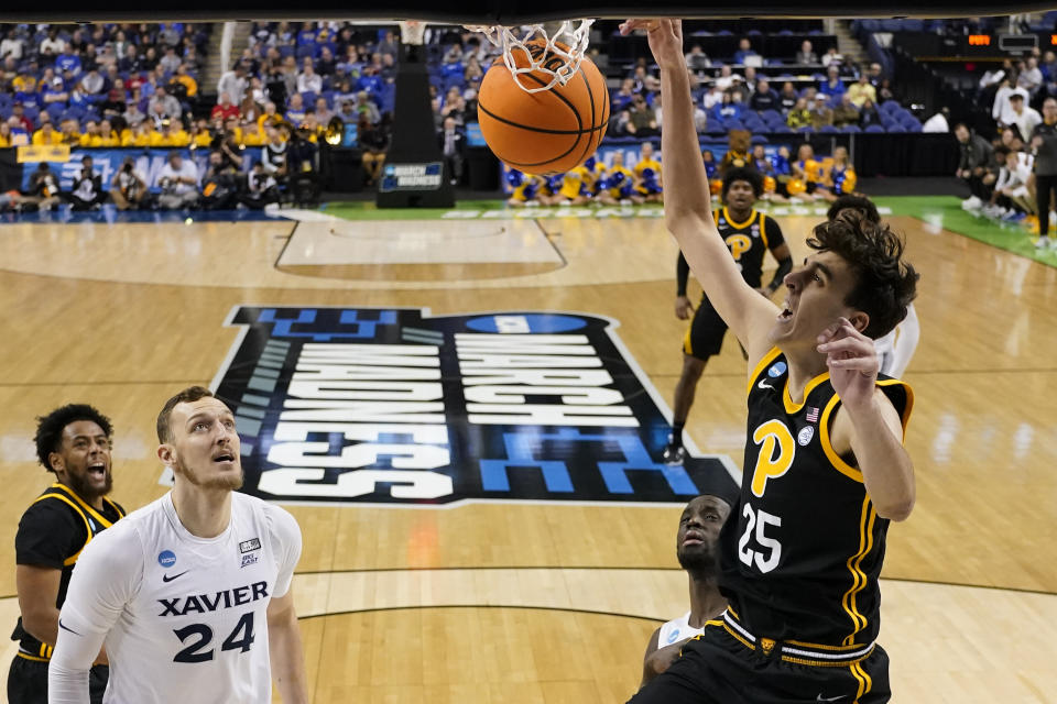 Pittsburgh forward Guillermo Diaz Graham dunks against Xavier during the first half of a second-round college basketball game in the NCAA Tournament on Sunday, March 19, 2023, in Greensboro, N.C. (AP Photo/Chris Carlson)