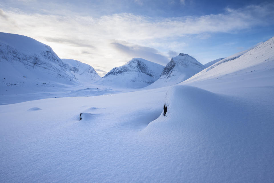 Winter mountain landscape of Ladtjovagge valley viewed from near Kebnekaise Fjallstation, Lapland