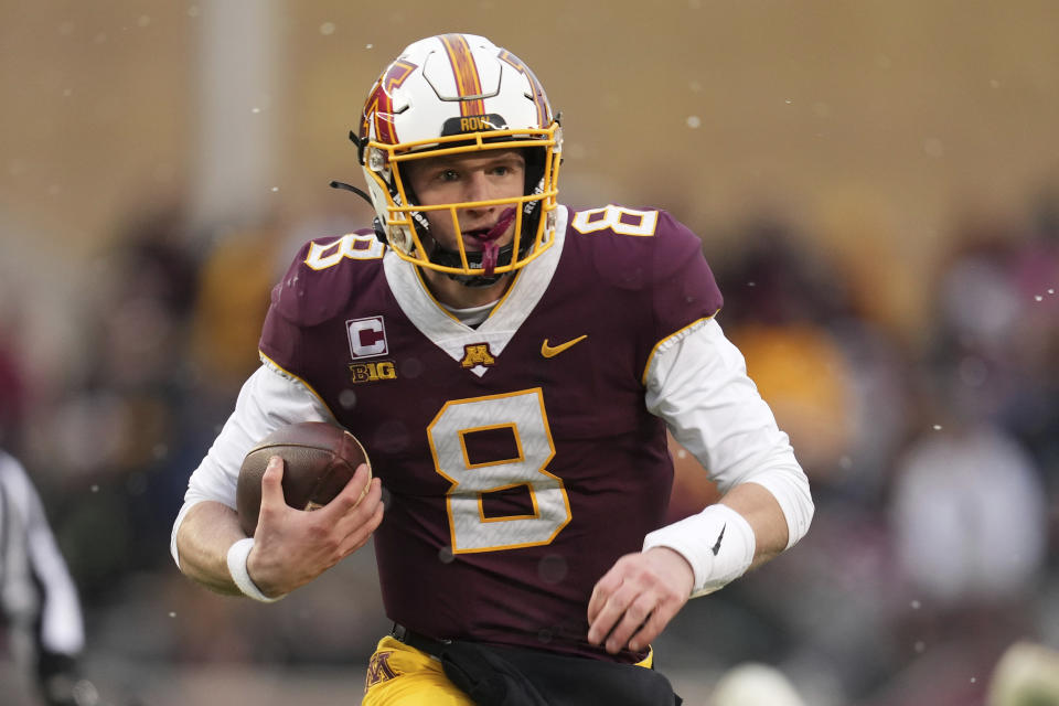 Minnesota quarterback Athan Kaliakmanis (8) runs down the field during the first half of an NCAA college football game against Northwestern, Saturday, Nov. 12, 2022, in Minneapolis. (AP Photo/Abbie Parr)