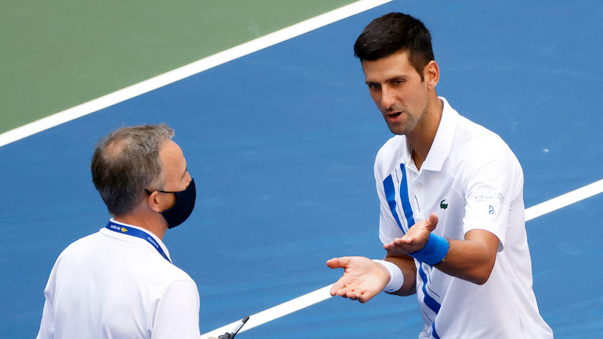 Pictured here, Novak Djokovic pleads his case with a US Open official after his fourth round controversy.