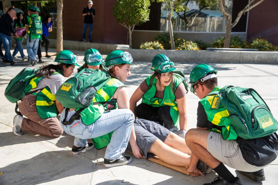 Cathedral City High School health academy students take part in an earthquake emergency response drill in Cathedral City, Calif., on Thurs., Oct. 19, 2023.