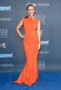 <p>Leslie shone in a bright orange ruffled design by Greta Constantine. <i>[Photo: Getty]</i> </p>