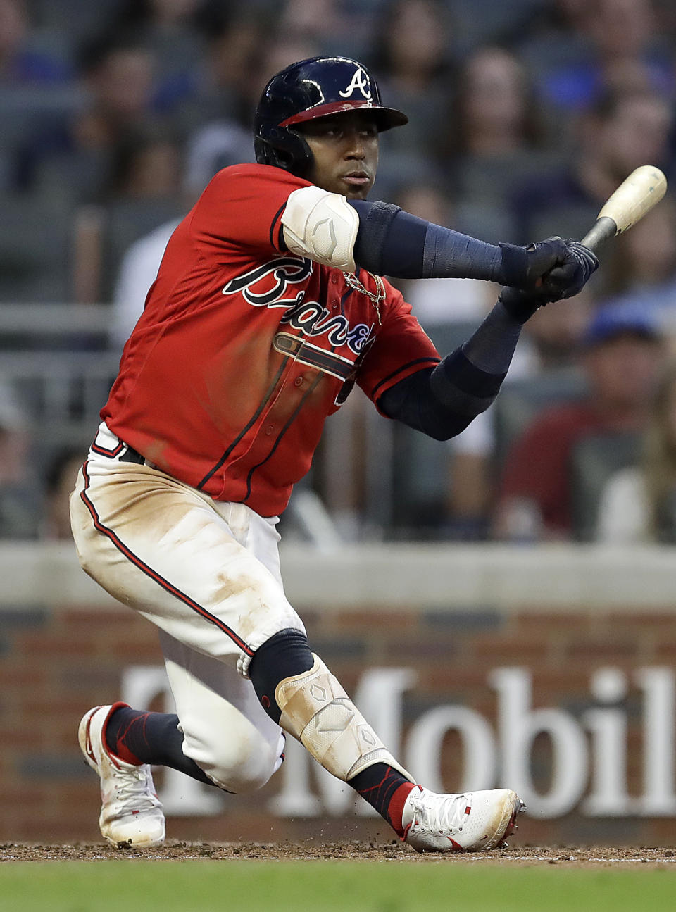 Atlanta Braves' Ozzie Albies swings for an RBI-double in the fourth inning of a baseball game against the St. Louis Cardinals, Friday, June 18, 2021, in Atlanta. (AP Photo/Ben Margot)