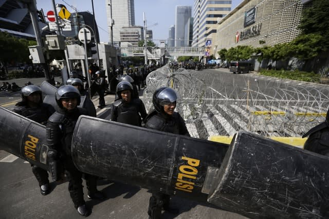 Riot police outside the Election Supervision Board in Jakarta