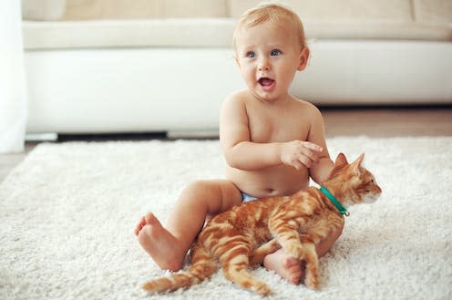   <span class="attribution"><a class="link " href="https://www.shutterstock.com/image-photo/toddler-playing-red-cat-on-white-221784694" rel="nofollow noopener" target="_blank" data-ylk="slk:Alena Ozerova/Shutterstock;elm:context_link;itc:0;sec:content-canvas">Alena Ozerova/Shutterstock</a></span>