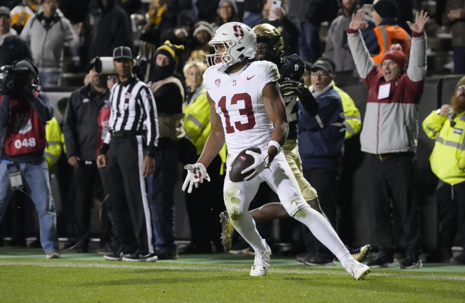 Stanford wide receiver Elic Ayomanor reacts after catching a pass for a touchdown over Colorado cornerback Travis Hunter in overtime of an NCAA college football game early Saturday, Oct. 14, 2023, in Boulder, Colo. (AP Photo/David Zalubowski)