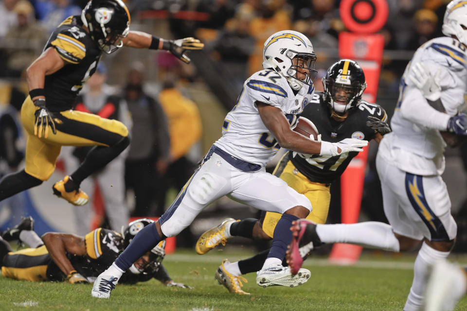 Los Angeles Chargers running back Justin Jackson (32) dashes between Pittsburgh Steelers linebacker L.J. Fort (54) and free safety Sean Davis (21) for a touchdown in the second half of an NFL football game, Sunday, Dec. 2, 2018, in Pittsburgh. (AP Photo/Don Wright)