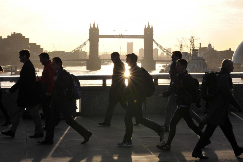 Morning commuters walk across London Bridge (AFP/Getty Images)