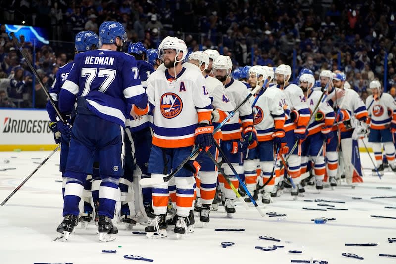 Tampa Bay Lightning defenseman Victor Hedman (77) and his teammates shake hands with New York Islanders right wing Josh Bailey, front right, and his teammates after Game 7 of an NHL Stanley Cup semifinal playoff series Friday, June 25, 2021, in Tampa, Fla. Tampa won the final game 1-0. | Chris O'Meara, Associated Press