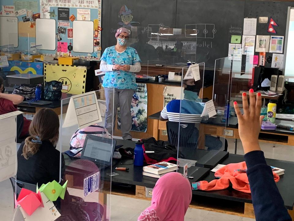 Becca McCray, an Edmunds Middle School nurse, answers questions from students at the Burlington school, April 2021. She is also the COVID Coordinator for the school district. The pandemic has taken a toll on school nurses but has also afforded McCray additional leadership opportunities during the school year.