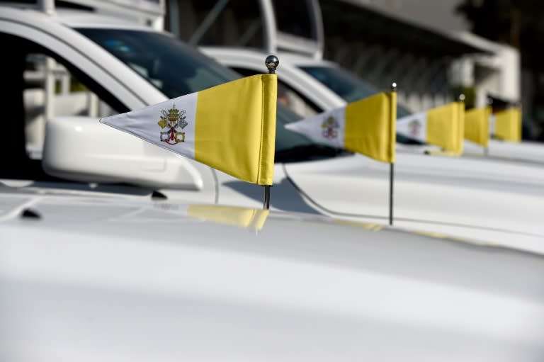 Vatican flags on vehicles that will be used by Pope Francis during his upcoming visit to Mexico, at Mexico City's international airport on February 8, 2016