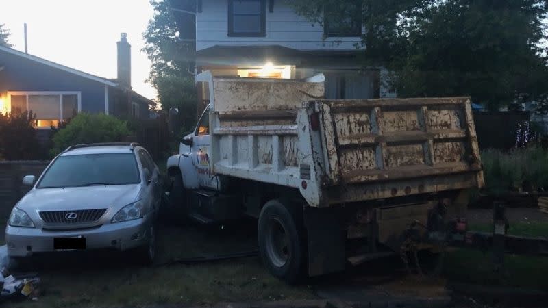 A stolen dump truck crashed into and destroyed several cars in NE Portland on June 1, 2023 (PPB)
