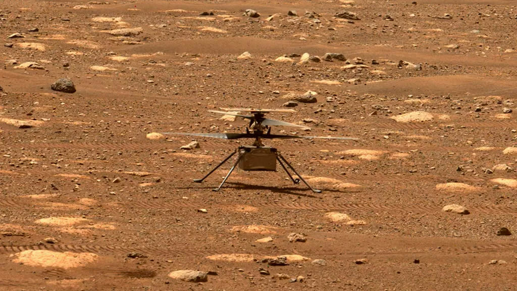  NASA's Mars Helicopter Ingenuity is seen by the Perseverance rover after unlocking its rotor blades on April 7, 2021. 