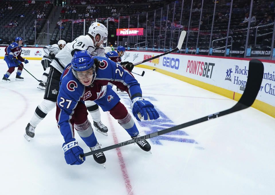 Los Angeles Kings left wing Carl Grundstrom (91) pushes down Colorado Avalanche defenseman Ryan Graves (27) during the first period of an NHL hockey game Thursday, May, 13, 2021, in Denver. (AP Photo/Jack Dempsey)