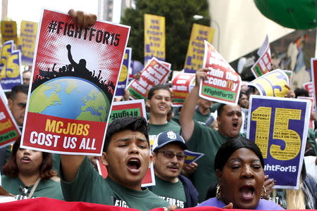 People protest for a $15-an-hour nationwide minimum wage in Los Angeles, California, United States, April 14, 2016. REUTERS/Lucy Nicholson