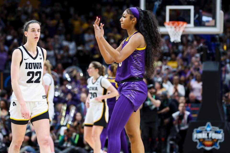 LSU's Angel Reese gestures toward Iowa's Caitlin Clark in the final moments of the NCAA women's title game.