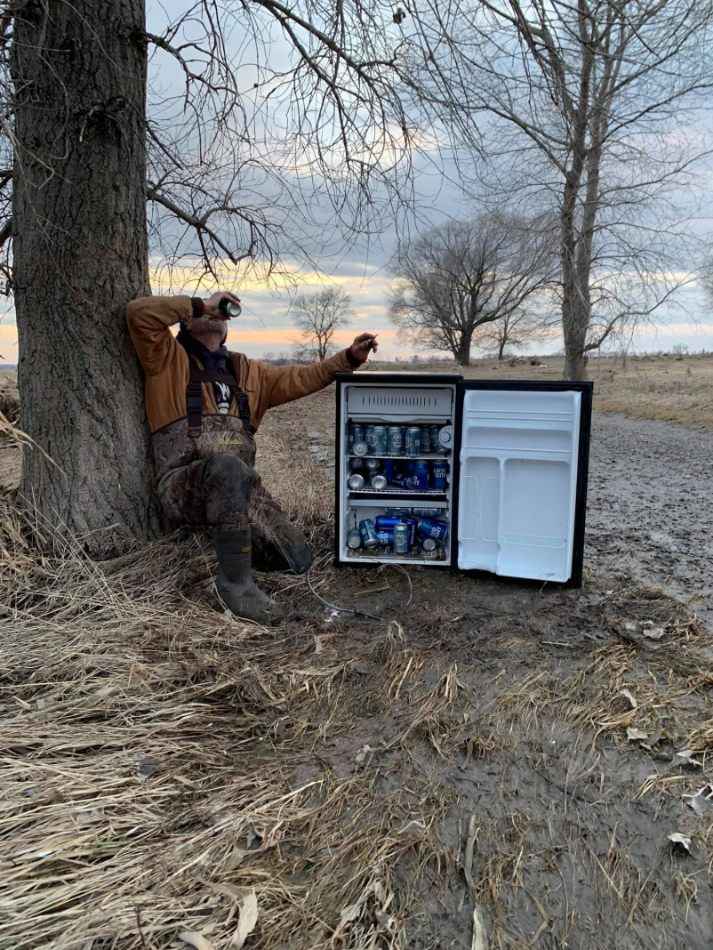 Two friends cleaning up after a flood were shocked to find a fridge full of cold beer. (Photo: Facebook)