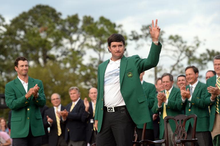 Bubba Watson of the US waves after wearing his Green Jacket during a ceremony at the end of the 78th Masters Golf Tournament, at Augusta National Golf Club in Georgia, on April 13, 2014