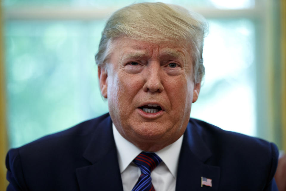 President Donald Trump speaks in the Oval Office of the White House in Washington, Friday, July 26, 2019. Trump announced that Guatemala is signing an agreement to restrict asylum applications to the U.S. from Central America.(AP Photo/Carolyn Kaster)