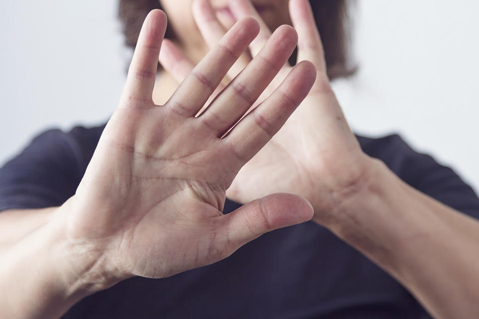 A woman making a self defense gesture