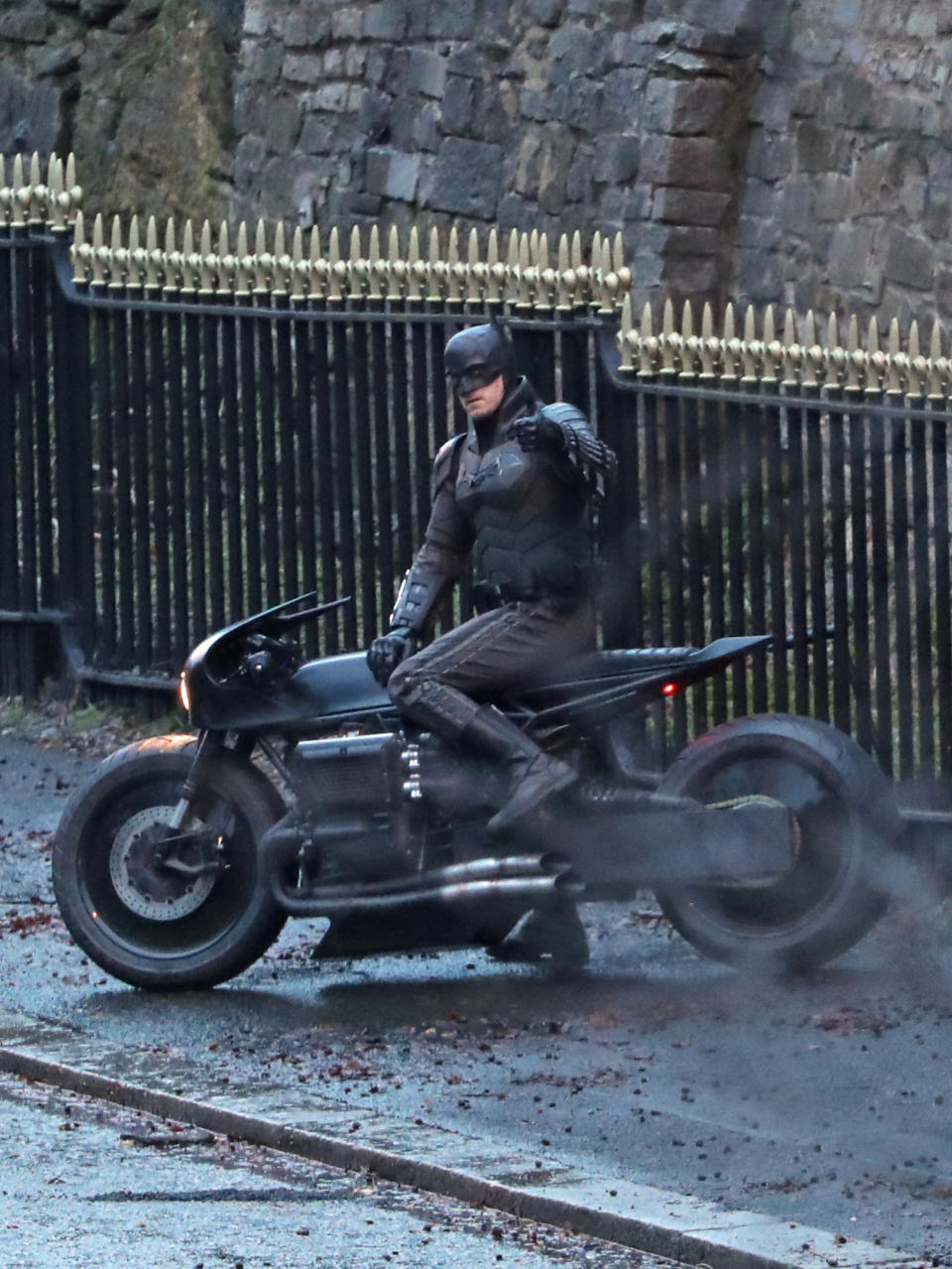 A man dressed as Batman gives a thumbs up as he sits on a motorcycle while filming continues in Glasgow for a new movie for the Batman superhero franchise. (Photo by Andrew Milligan/PA Images via Getty Images)