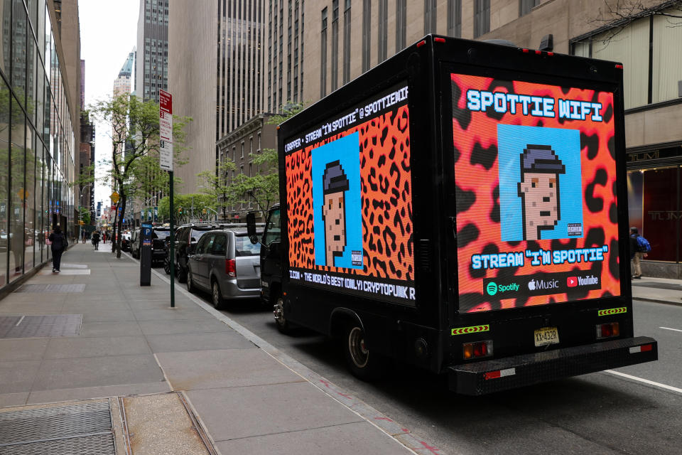 NEW YORK, NEW YORK - MAY 11: A truck parked outside of Christie's auction house displays a CryptoPunk digital art non-fungible token (NFT) on electronic billboards on May 11, 2021 in New York City. Christie's is auctioning nine of Larva Labs' CryptoPunks NFTs during its 21st Century Evening Sale. (Photo by Dia Dipasupil/Getty Images)