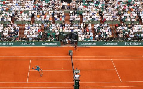 Nadal makes a volley against Thiem - Credit: Getty Images