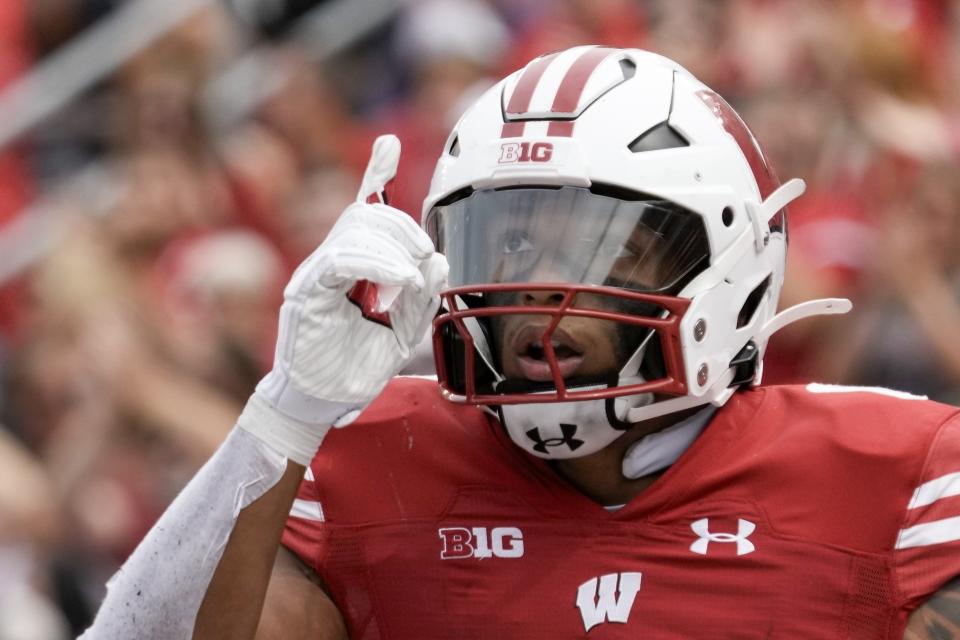 FILE - Wisconsin's Braelon Allen celebrates his touchdown run during the second half of an NCAA college football game against Georgia Southern Saturday, Sept. 16, 2023, in Madison, Wis. Allen is among the young running backs who say they love their position on the field and aren't swayed away from it by the recent hesitancy of NFL teams in handing out big contracts to running backs. (AP Photo/Morry Gash, File)