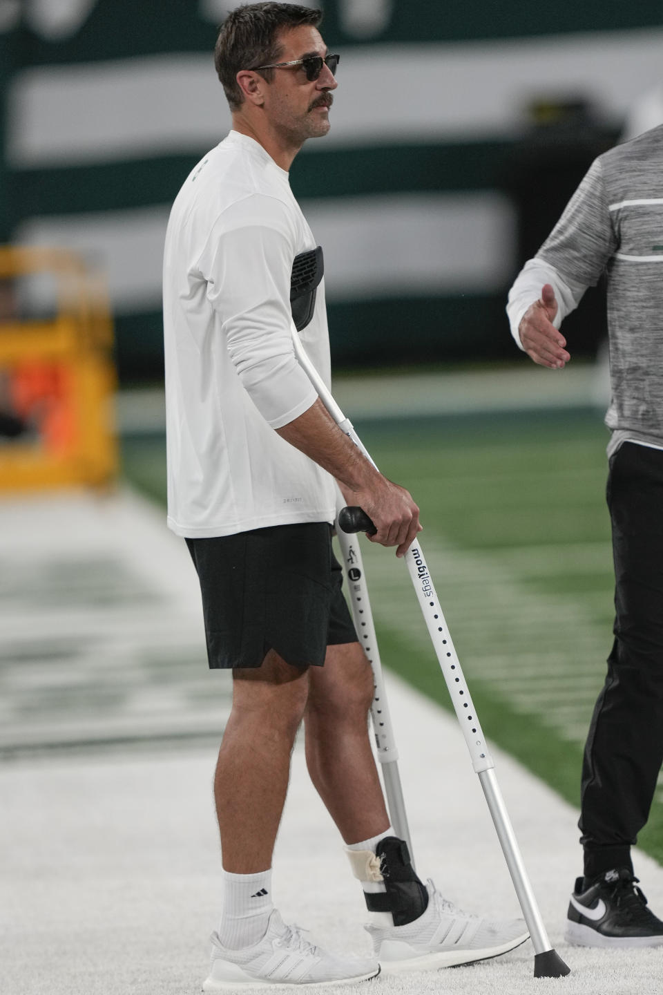 New York Jets quarterback Aaron Rodgers stands on the sideline before an NFL football game against the Kansas City Chiefs on Sunday Oct. 1, 2023, in East Rutherford, NJ. (AP Photo/Bryan Woolston)