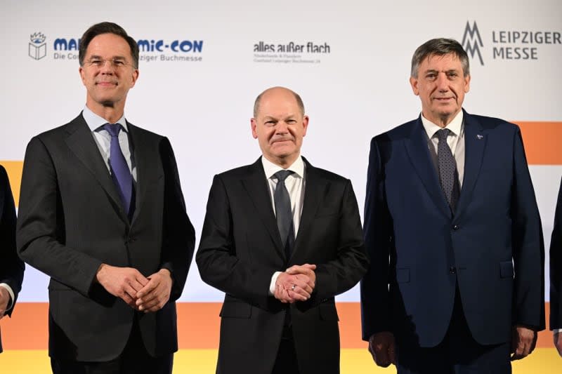 German Chancellor Olaf Scholz (C) joins Prime Minister of the Netherlands Mark Rutte (L) and Prime Minister of Flanders Jan Jambon, attend the official opening event of the Leipzig Book Fair in the Gewandhaus. Exhibitors from around 40 countries present their new products at the spring meeting of the book industry. The Netherlands and Flanders are represented as guest countries this year. Hendrik Schmidt/dpa