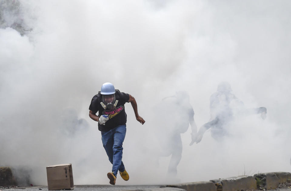 A demonstrator flees from tear gas on July 20.