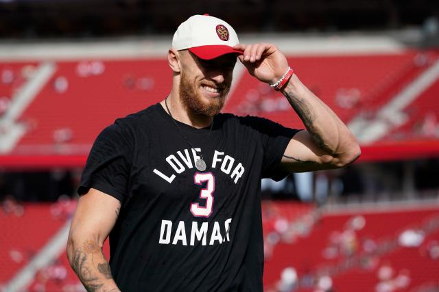 Arizona Cardinals defensive end J.J. Watt wears a shirt for Damar Hamlin  during warms up before an NFL football game against the San Francisco 49ers  in Santa Clara, Calif., Sunday, Jan. 8